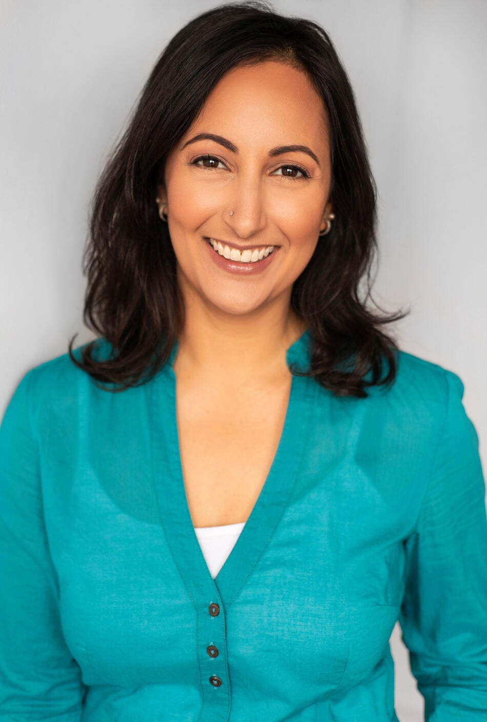 Actor, writer, producer Salma Dharsee in a blue shirt.